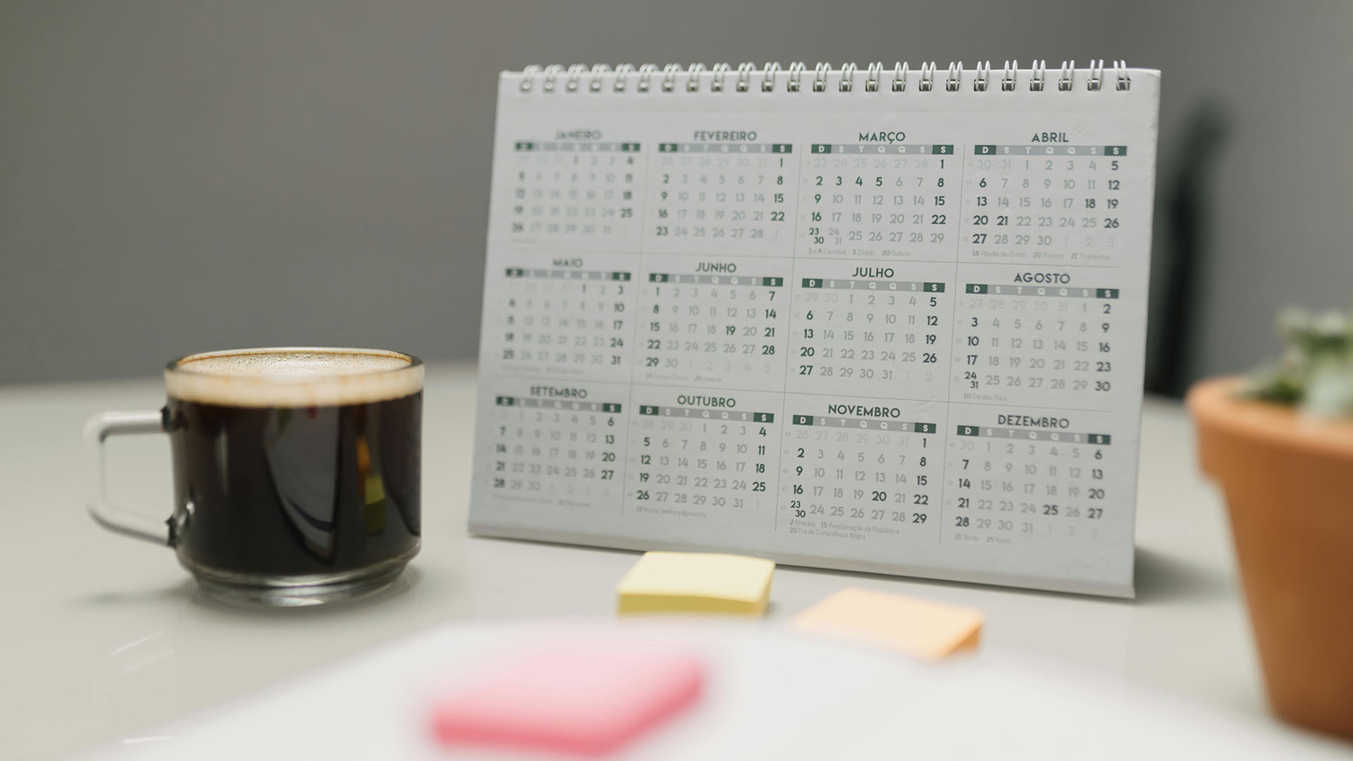 A table calendar with a cup of coffee